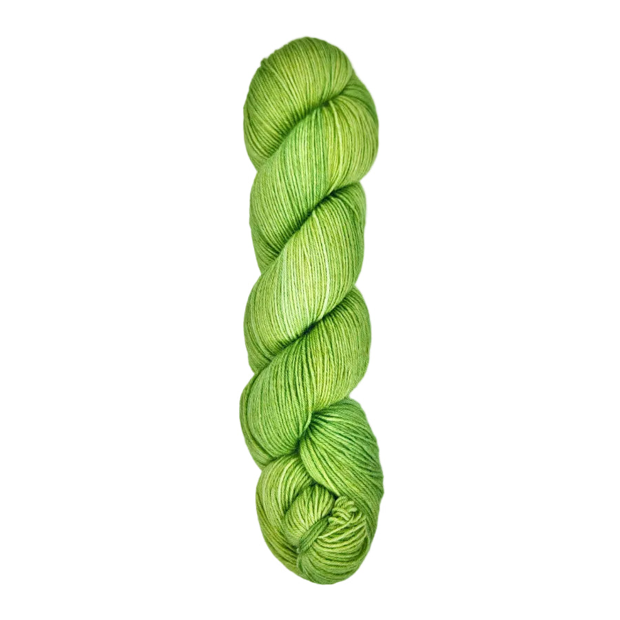 A skein of hand-dyed fingering/sock yarn color bright green