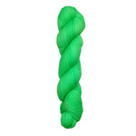 A skein of hand-dyed fingering/sock yarn color green 