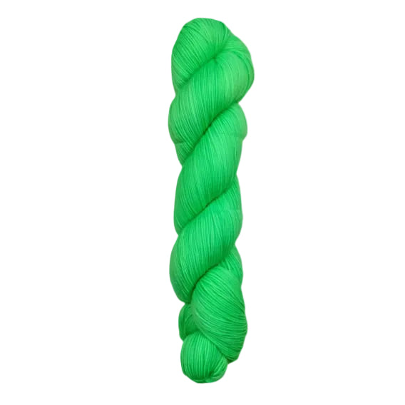 A skein of hand-dyed fingering/sock yarn color green 