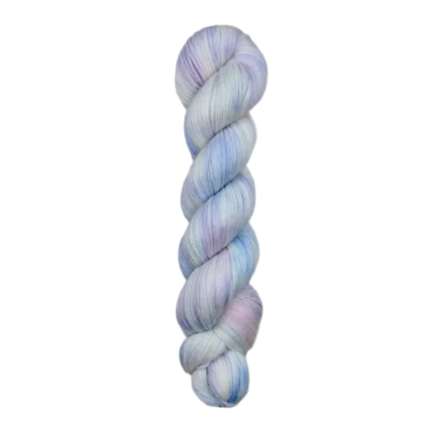 A skein of hand-dyed fingering/sock yarn color white pastel pink purple blue 