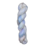 A skein of yarn with blue and white colors on a white background