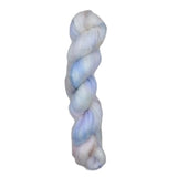 A skein of yarn with blue and white colors on a white background