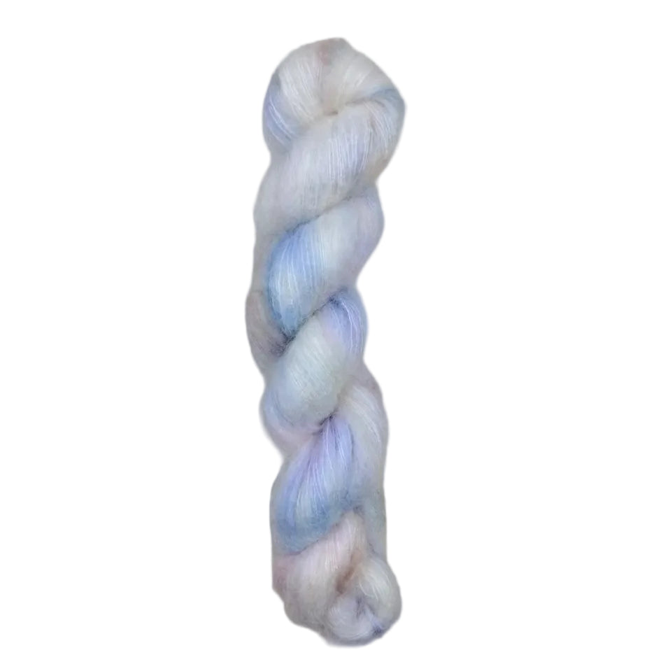A skein of yarn with blue and white colors on a white background
