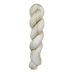 A skein of hand-dyed fingering/sock yarn color off-white grey