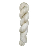 A skein of hand-dyed fingering/sock yarn color off-white grey