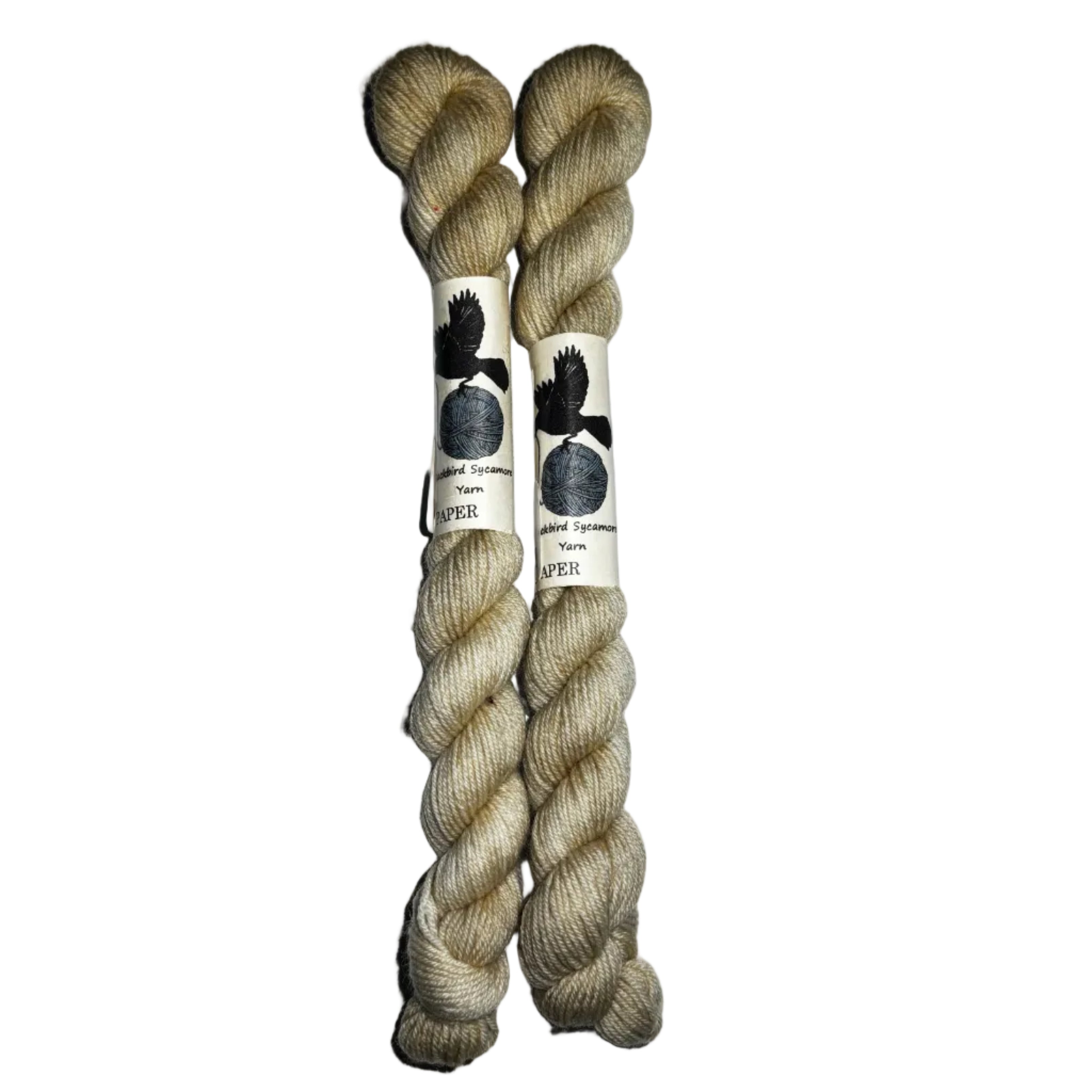 Two mini skeins of  off white yarn on a white background 