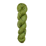 Green skein of yarn with black speckles on a white background