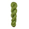 Green skein of yarn with black speckles on a white background