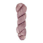 A skein of hand-dyed fingering/sock yarn color dusty pink