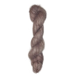 Skein of hand dyed suri silk yarn color dusty rose