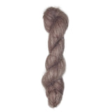 Skein of hand dyed suri silk yarn color dusty rose