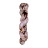 Skein of superkid mohair silk lace weight yarn color brown pink