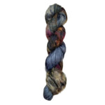 Skein of superkid mohair silk lace weight yarn color blue brown red black