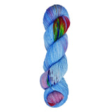 A skein of hand-dyed fingering/sock yarn color blue purple red green speckles