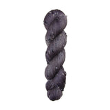 gray skein of yarn with black and white specks