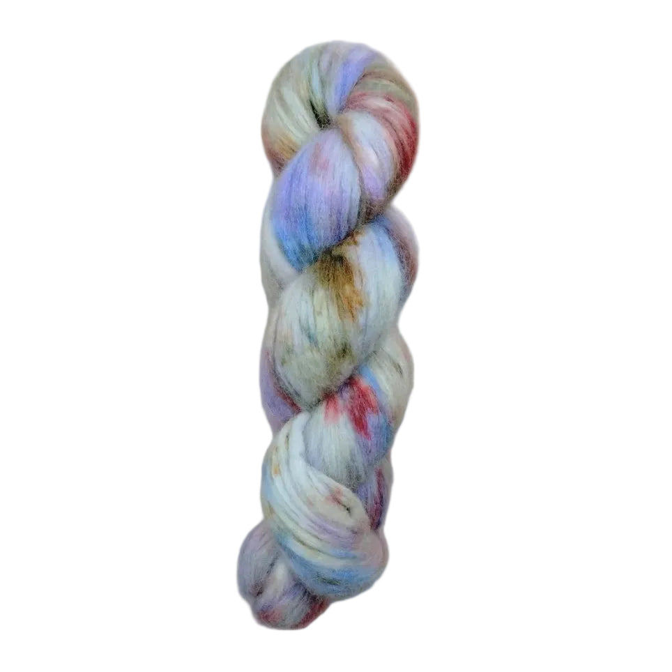 Multicolored skein of yarn with red, purple, blue, and green on a white background