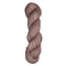 Skein of hand dyed fingering weight yarn in the color dusty rose
