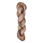 A skein of hand-dyed fingering/sock yarn color pink brown burgundy speckles