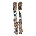 Two mini skeins of wool yarn hand dyed in Wyoming in the color pink brown speckles