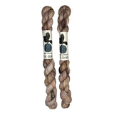 Two mini skeins of wool yarn hand dyed in Wyoming in the color pink brown speckles