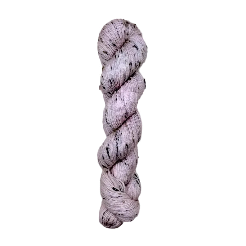 Skein of hand dyed BFL Tweed Yarn color dusty rose
