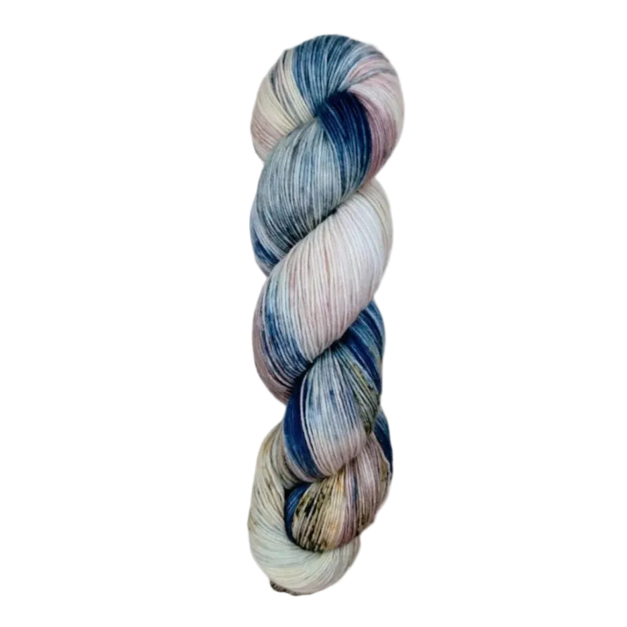 A skein of hand-dyed fingering/sock yarn color pink white blue brown speckles