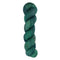 A skein of hand-dyed fingering/sock yarn color dark green