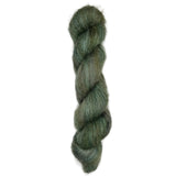Hand dyed skein of silk mohair in the colors green brown black