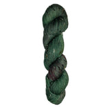Skein of hand-dyed BFL Tweed wool yarn in the color green and streaks of red
