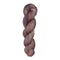 Fingering weight yarn skein with purple, pink, and brown tones on a white background