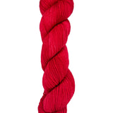 A skein of hand-dyed fingering/sock yarn color red