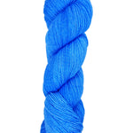 A skein of hand-dyed fingering/sock yarn color blue