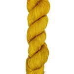A skein of hand-dyed fingering/sock yarn color golden yellow