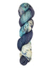 A skein of hand-dyed fingering/sock yarn color sky blue black white grey speckles