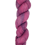 A skein of hand-dyed fingering/sock yarn color pink purple