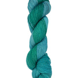 A skein of hand-dyed fingering/sock yarn color blue teal green 