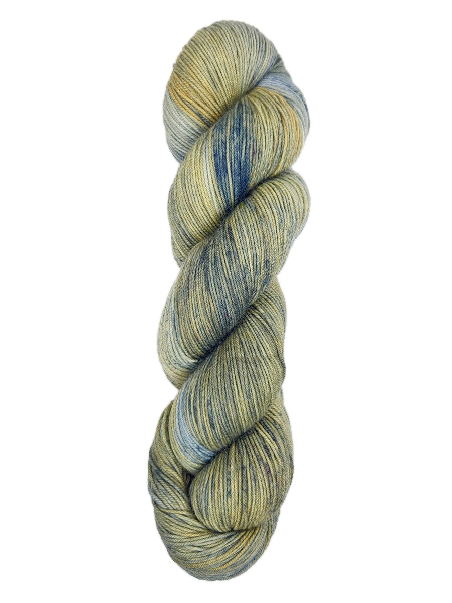 A skein of hand-dyed fingering/sock yarn color grey tan navy speckles