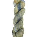 A skein of hand-dyed fingering/sock yarn color grey tan navy speckles