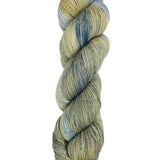 A skein of hand-dyed fingering/sock yarn color grey tan navy speckles