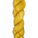 A skein of hand-dyed fingering/sock yarn color golden yellow orange speckles