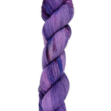 A skein of hand-dyed fingering/sock yarn color purple blue red speckles