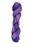 A skein of hand-dyed fingering/sock yarn color purple blue red speckles