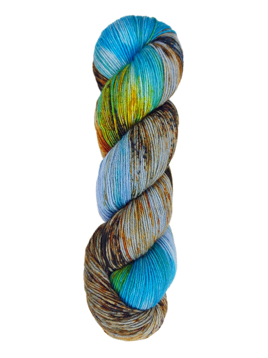 A skein of hand-dyed fingering/sock yarn color blue yellow grey orange brown green speckles