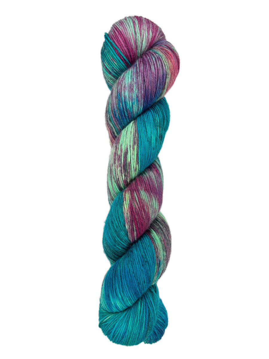 A skein of hand-dyed fingering/sock yarn color green blue pink purple speckles