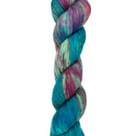 A skein of hand-dyed fingering/sock yarn color green blue pink purple speckles