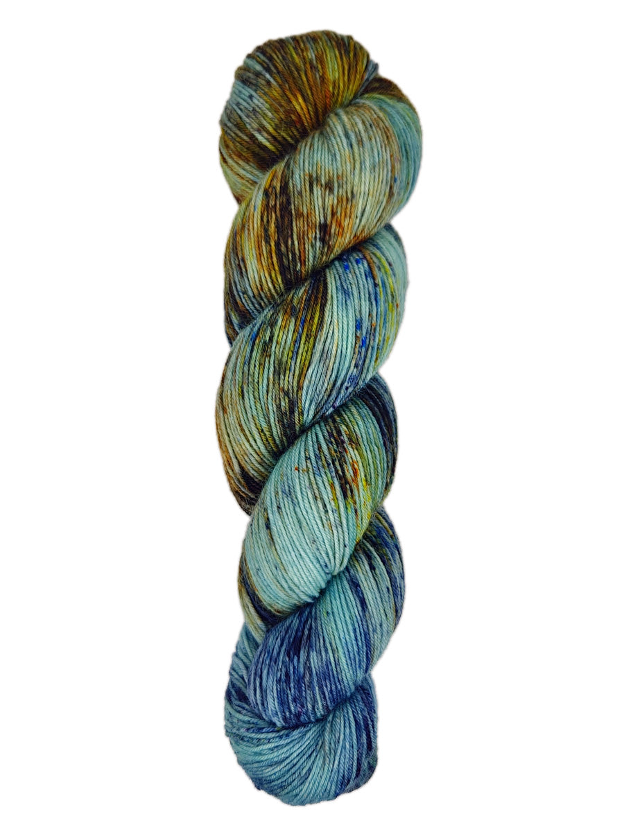 A skein of hand-dyed fingering/sock yarn color blue brown orange speckles