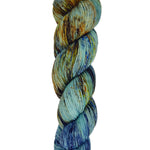 A skein of hand-dyed fingering/sock yarn color blue brown orange speckles