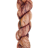 A skein of hand-dyed fingering/sock yarn color pink brown orange mauve speckles