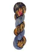 A skein of hand-dyed fingering/sock yarn color grey brown red black speckles