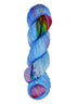 A skein of hand-dyed fingering/sock yarn color blue purple red green speckles